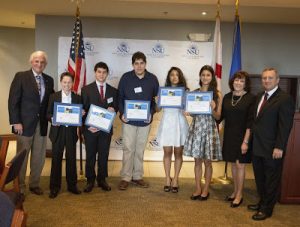 NSU President George Hanbury (left) and Barbra (second from right) and Craig Weiner, of the Holocaust Learning and Education Fund, congratulate winners in the statewide writing, essay and artwork contest commemorating the Holocaust. They include (from l. to r.): Elijah Bishop, Garrett Gold, Ariel Desler, Dominique Deer and Nina Gulati.