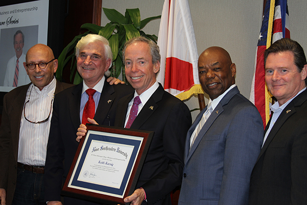Distinguished Lecture Series speaker Keith Koenig (center) is congratulated by (from l. to r.) NSU Board of Trustee member Steve Halmos; NSU President George L. Hanbury II, Ph.D.; Preston Jones, D.B.A., dean of the H. Wayne Huizenga College of Business and Entrepreneurship; and NSU Board of Trustee member Paul Sallarulo, who also serves as chairman of the Huizenga College’s Board of Governors.
